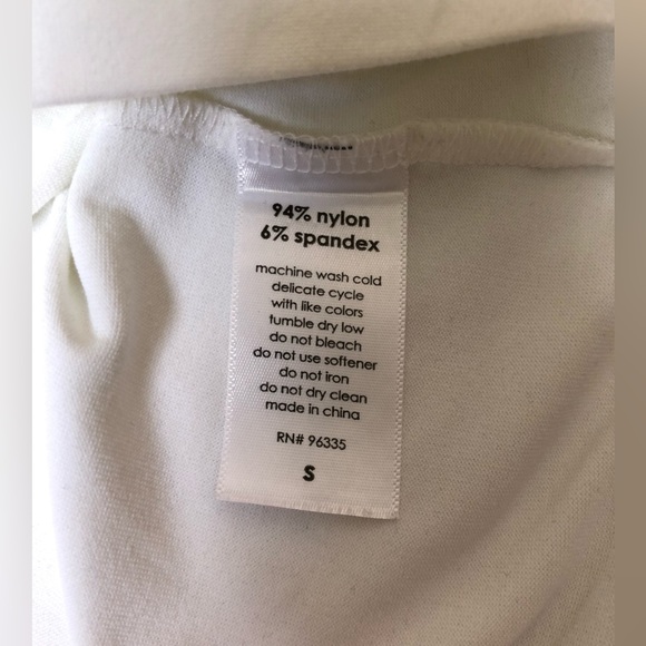 Mockneck white blouse with tie closure. - Picture 6 of 7